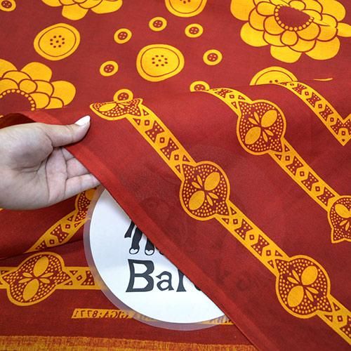 アフリカの布カンガ 23～わが子のために（赤×黄） - アフリカフェ